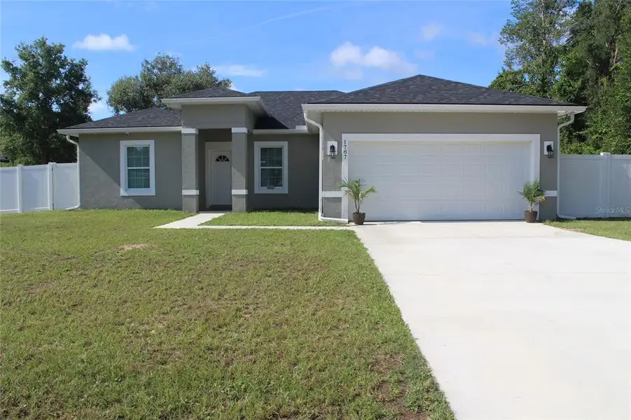 Front exterior of a new home in , Ocala, FL, highlighting curb appeal (Image 1). Front exterior of a new home in , Ocala, FL, highlighting curb appeal (Image 1).