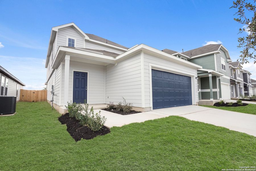 Front exterior of a new home in Timber Creek, San Antonio, TX, highlighting curb appeal (Image 20). Front exterior of a new home in Timber Creek, San Antonio, TX, highlighting curb appeal (Image 20).