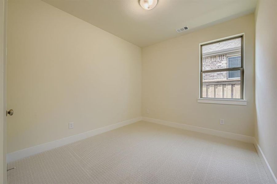 Unfurnished room with carpet flooring