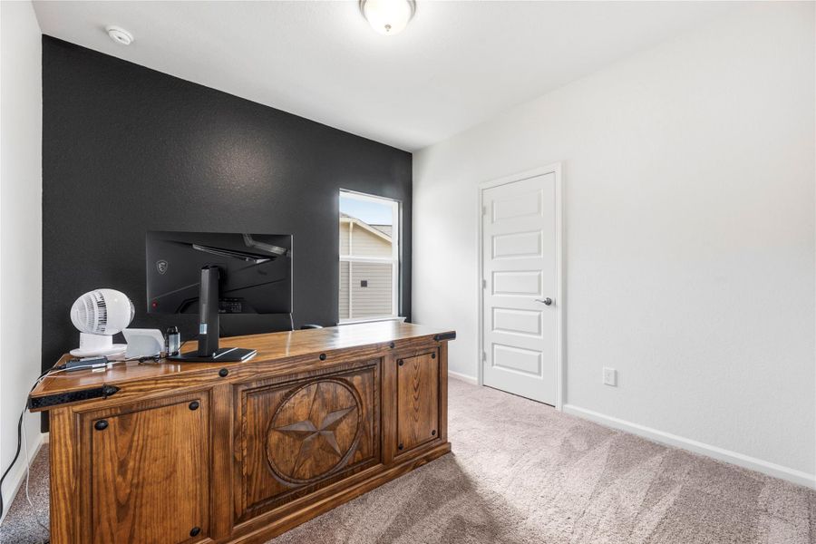Secondary bedroom currently furnished as a home office. Secondary bedroom currently furnished as a home office.