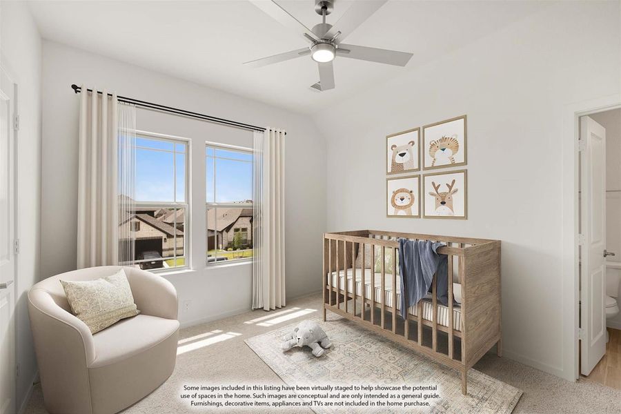 Nursery with wooden crib, ceiling fan, accent chair, and large window with natural light