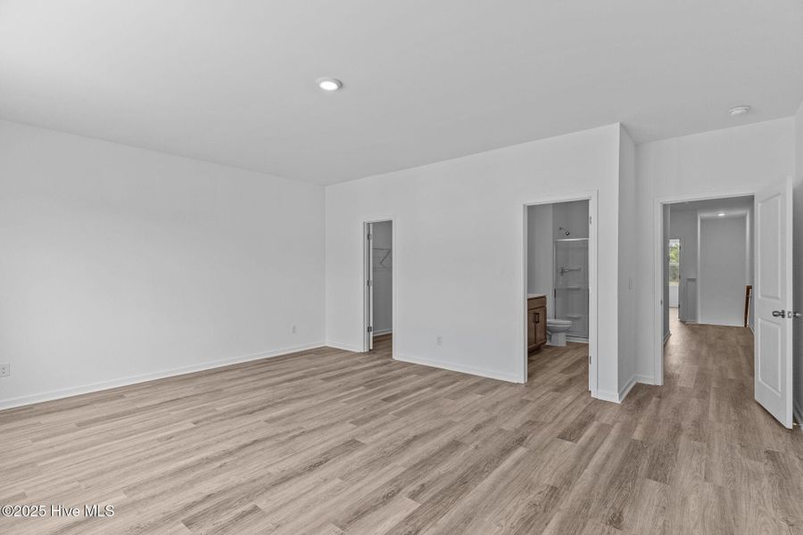 Spacious, unfurnished interior of a new home in Coastal Haven Townes, Leland (Image 22).