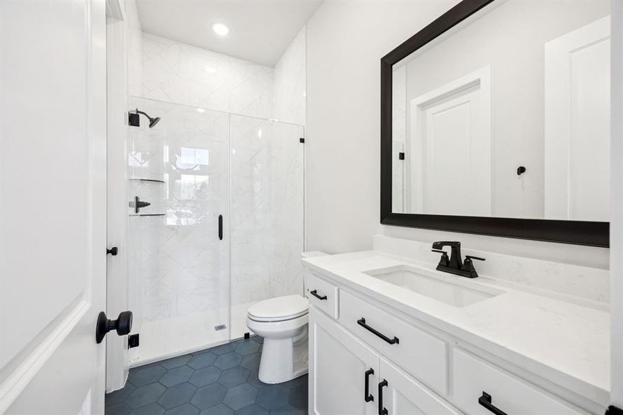 Guests will feel right at home in either of the beautifully finished guest baths.