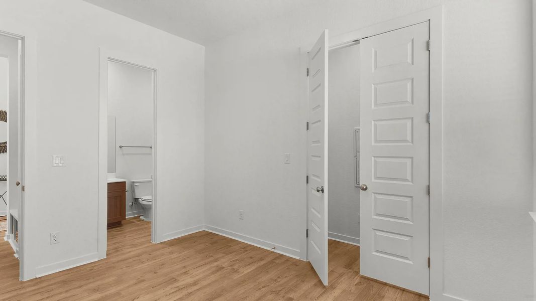Representative unfurnished interior of a home built from the Lauren by Chesmar Homes in University Heights, Round Rock (Image 17).