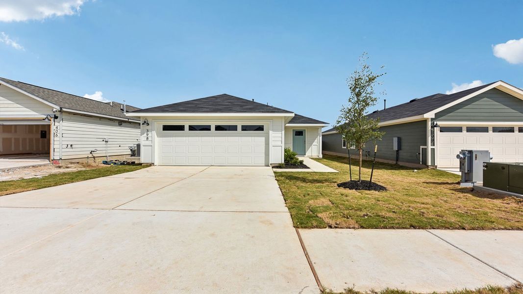 Front exterior of a new home in Watermill, Uhland, TX, highlighting curb appeal (Image 2). Front exterior of a new home in Watermill, Uhland, TX, highlighting curb appeal (Image 2).