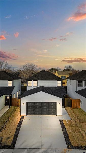 Contemporary house with a garage and a yard