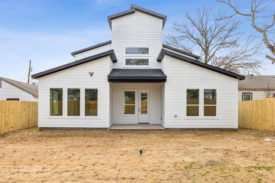 Back of house with a patio