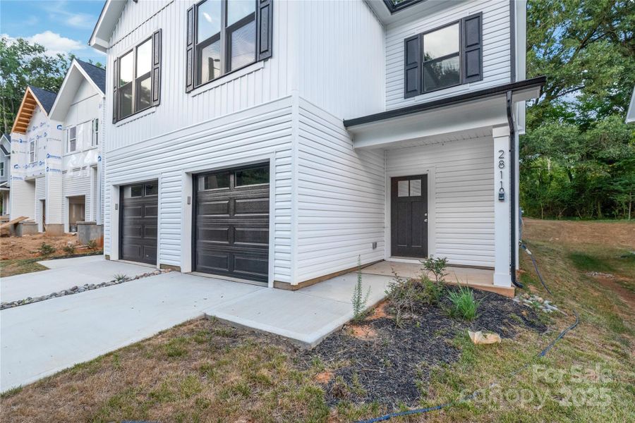 Front exterior of a new home in , Charlotte, NC, highlighting curb appeal (Image 23). Front exterior of a new home in , Charlotte, NC, highlighting curb appeal (Image 23).