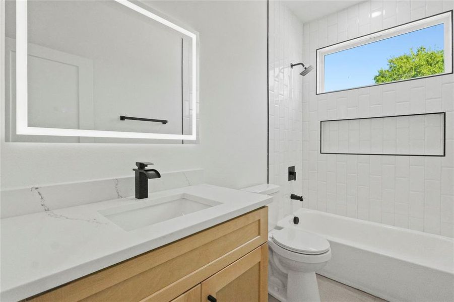 Full bathroom with vanity and bathtub / shower combination Full bathroom with vanity and bathtub / shower combination