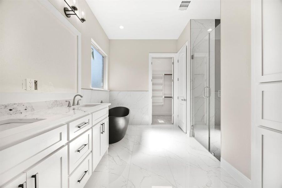 Main Bathroom with a large shower, tile walls and flooring