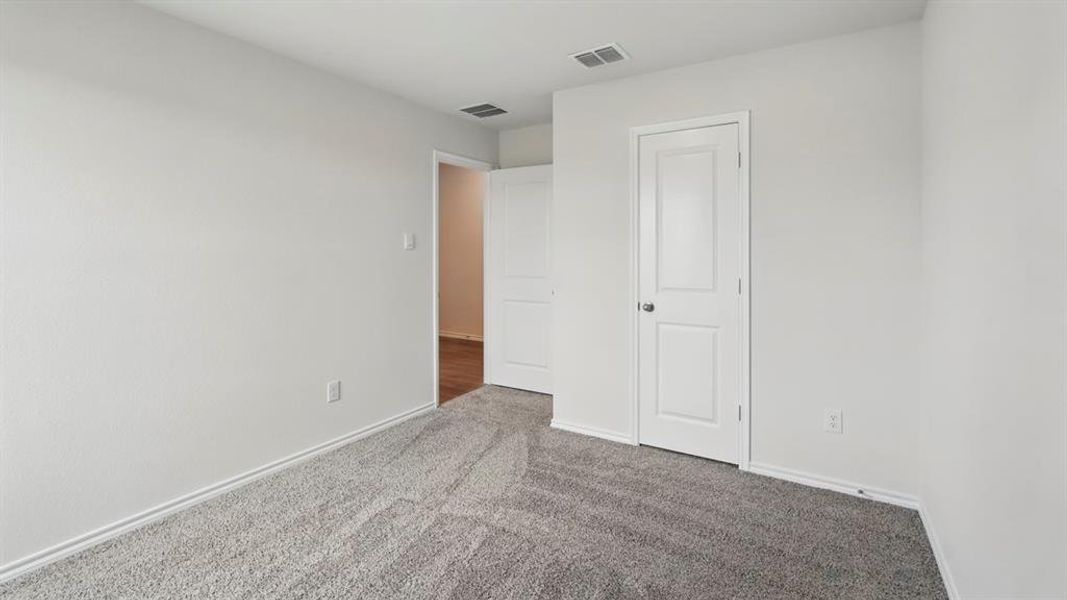 Neutral-toned walls complementing gray patterned carpet
