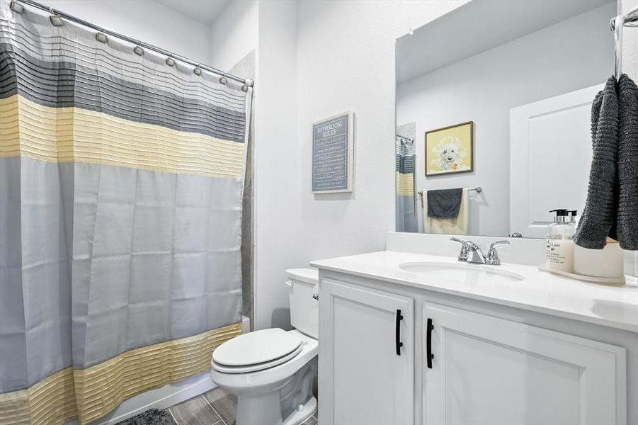 Bathroom with vanity and toilet