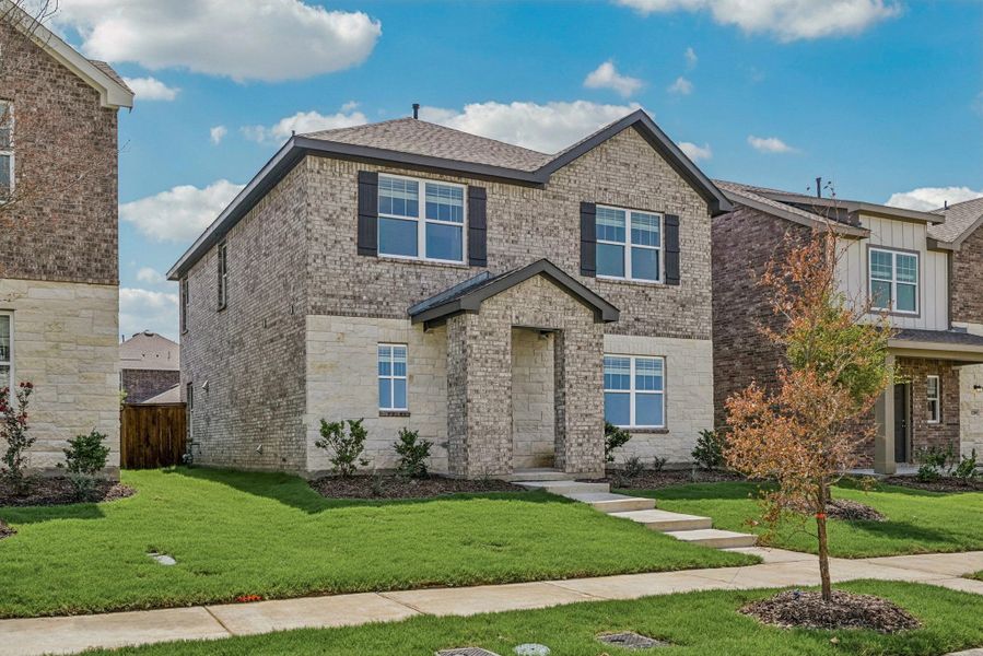 Representative exterior photo of a completed home built from the Eris by Starlight Homes in Brookshire at Legacy Hills, Celina, TX (Image 23). Representative exterior photo of a completed home built from the Eris by Starlight Homes in Brookshire at Legacy Hills, Celina, TX (Image 23).