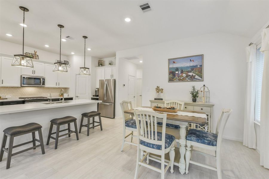 The dining area and kitchen flow together beautifully.  The dining room can easily accommodate a 6 seat table.