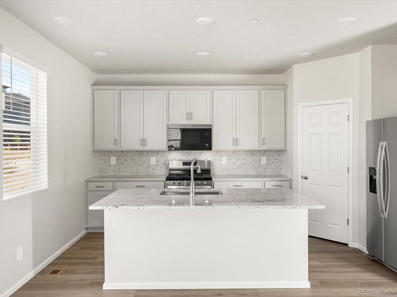 Furnished interior view inside a new home in Buffalo Highlands: The Flora Collection, Commerce City (Image 7).