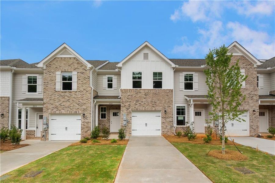 Front exterior of a new home in Avery Landing, McDonough, GA, highlighting curb appeal (Image 22).