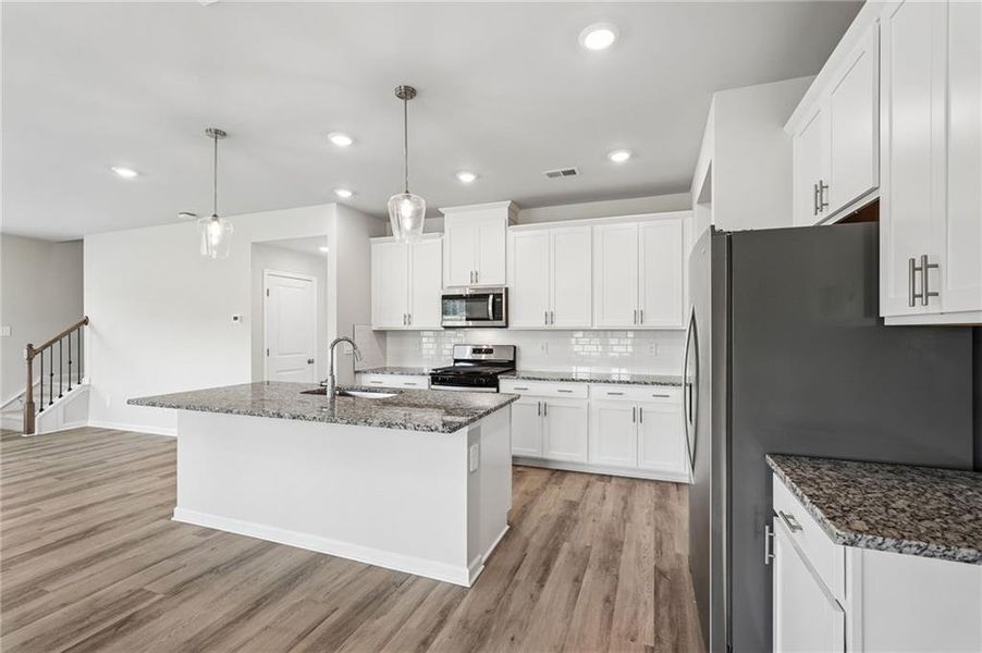 Furnished interior view inside a new home in Northwoods at Mirror Lake, Villa Rica (Image 7).