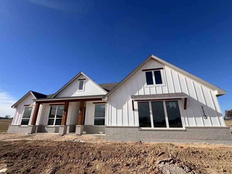Front exterior of a new home in Zion Valley, Poolville, TX, highlighting curb appeal (Image 2).