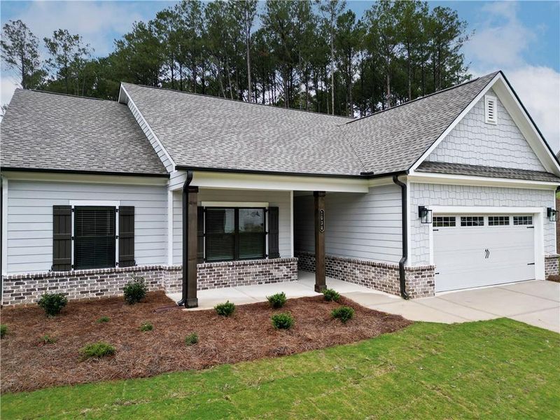 Front exterior of a new home in Red Oak Ridge, Loganville, GA, highlighting curb appeal (Image 2). Front exterior of a new home in Red Oak Ridge, Loganville, GA, highlighting curb appeal (Image 2).