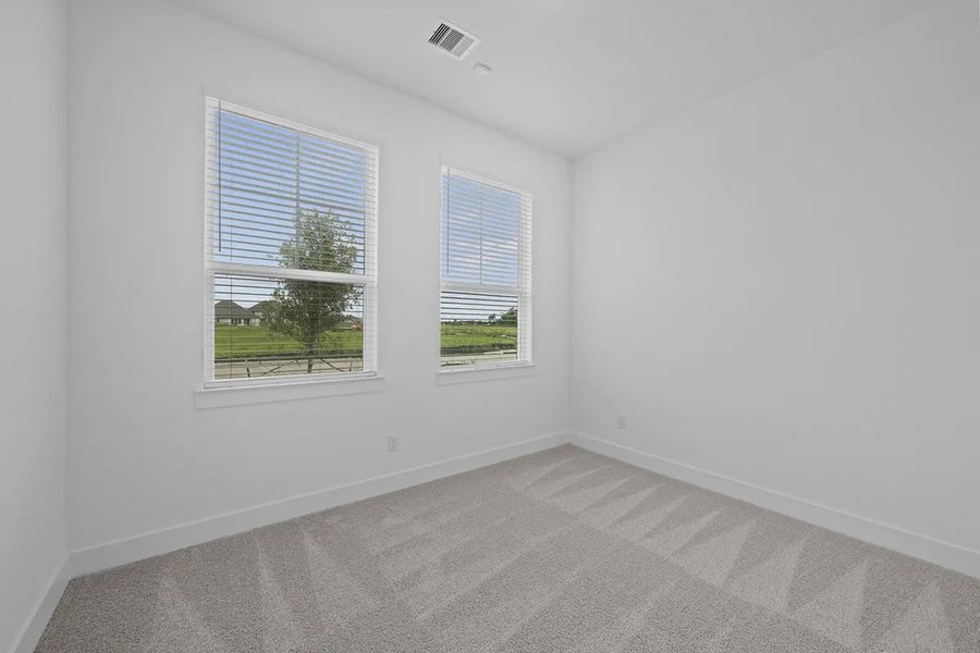 Representative unfurnished interior of a home built from the Summerton by Chesmar Homes in University Heights, Round Rock (Image 16).