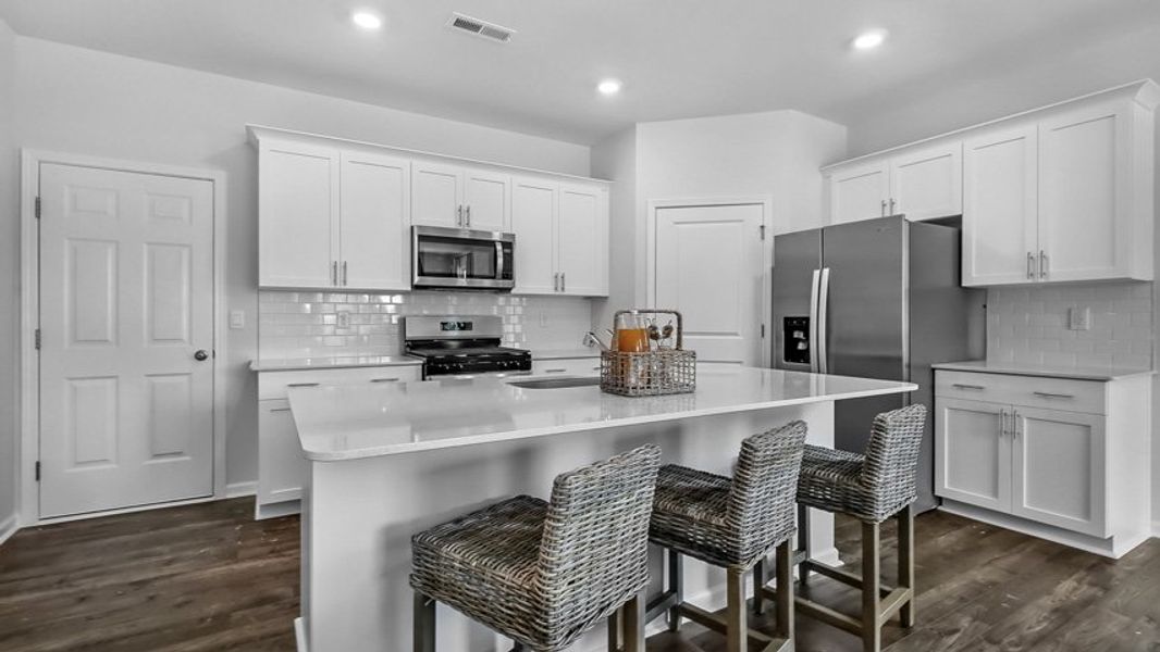 Representative furnished interior of a home built from the Collin by D.R. Horton in The Townes at Anderson Farm, Wendell (Image 5).