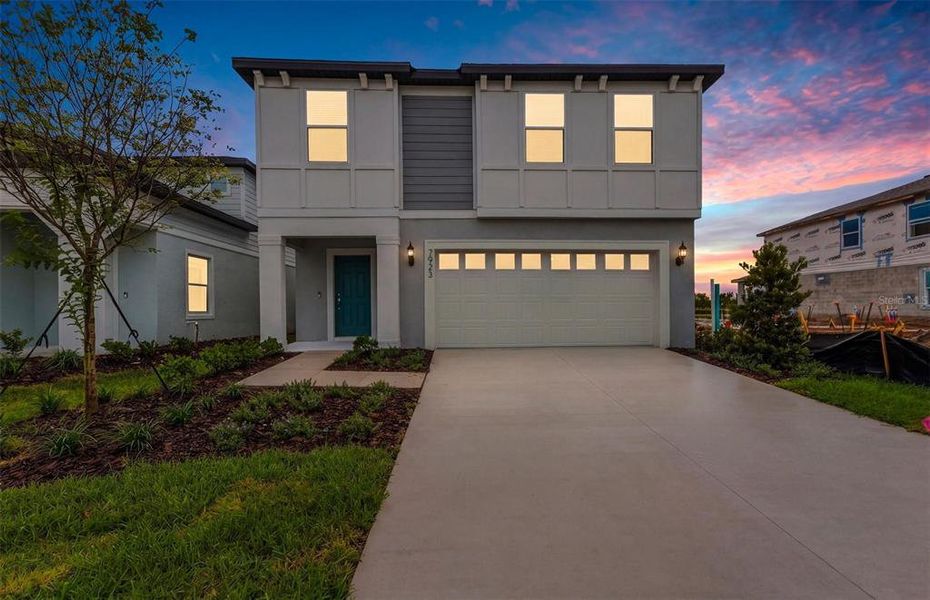 Front exterior of a new home in Seaire, Parrish, FL, highlighting curb appeal (Image 2). Front exterior of a new home in Seaire, Parrish, FL, highlighting curb appeal (Image 2).