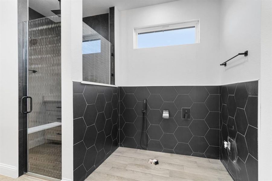 Bathroom featuring tiled shower