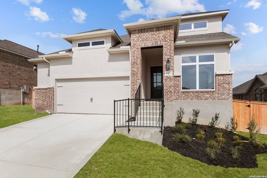 Front exterior of a new home in Ladera, San Antonio, TX, highlighting curb appeal (Image 21). Front exterior of a new home in Ladera, San Antonio, TX, highlighting curb appeal (Image 21).