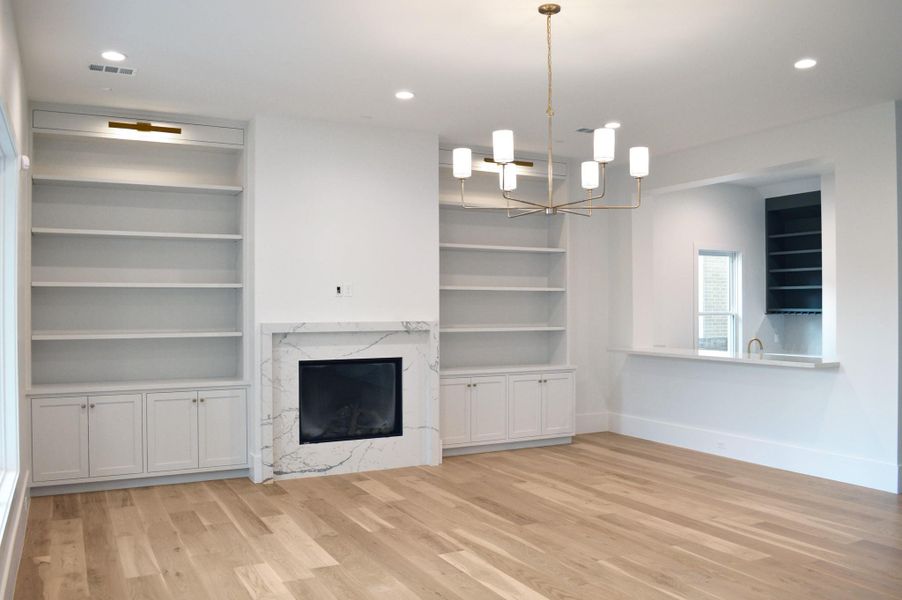 Another angle of the living room (fireplace mantle was installed 10/25) and amazing bar area for entertaining.
