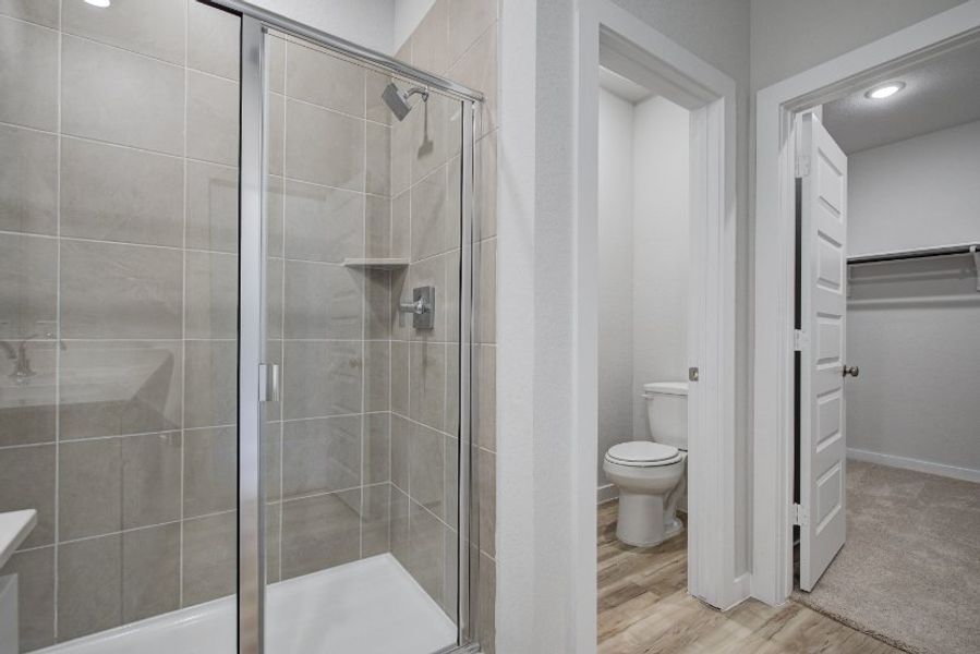 A bathroom with a glass shower.