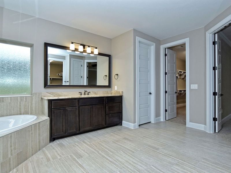 Representative furnished interior of a home built from the Madera II by Giddens Homes in Scofield Farms Estates, Georgetown (Image 255).