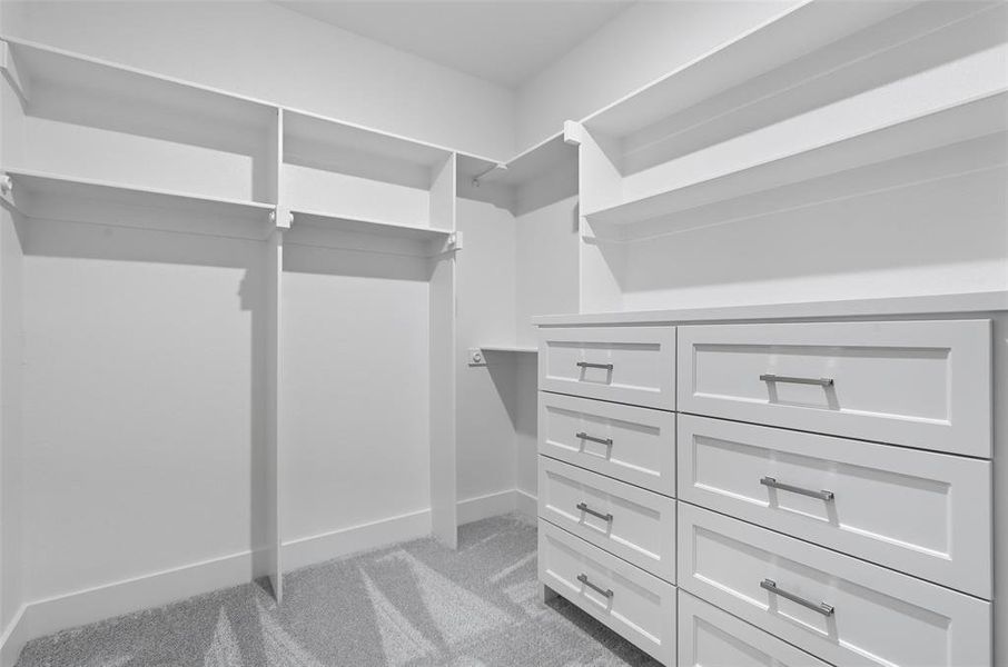 Walk in closet with light colored carpet Walk in closet with light colored carpet