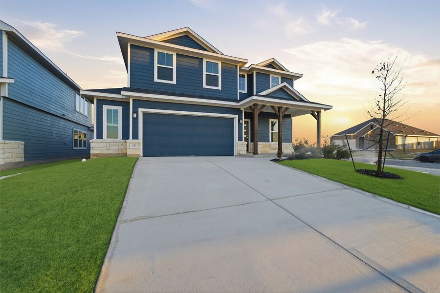 Front exterior of a new home in Hunters Glen, Jarrell, TX, highlighting curb appeal (Image 2).