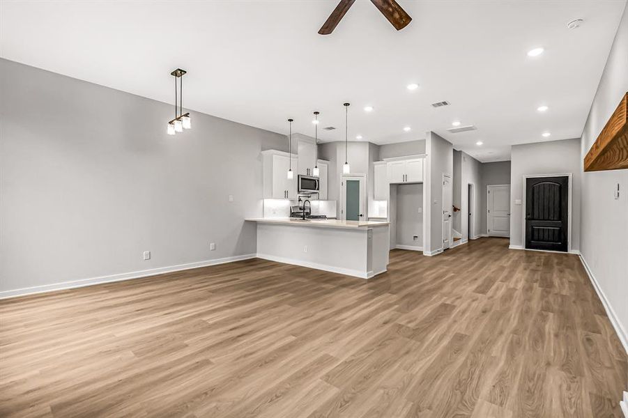 A look back at the front door and kitchen from the living room.