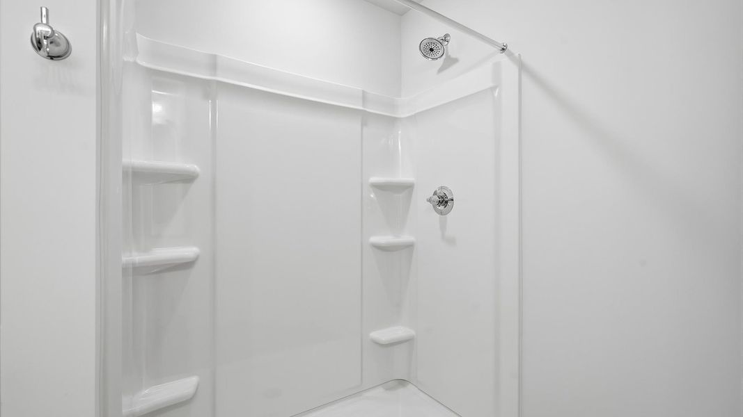 Notable primary bath featuring dual vanity, walk-in shower, and tasteful design touches throughout at Aspen Ridge Notable primary bath featuring dual vanity, walk-in shower, and tasteful design touches throughout at Aspen Ridge