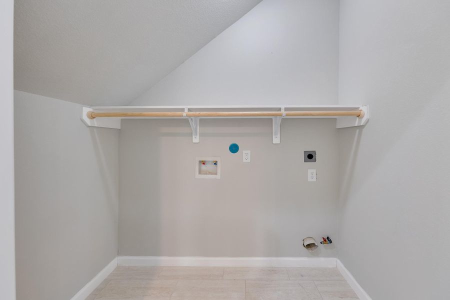A convenient dedicated indoor utility room provides a functional, organized space for laundry and storage right where you need it.