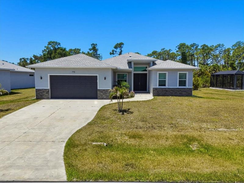 Front exterior of a new home in , Rotonda West, FL, highlighting curb appeal (Image 2). Front exterior of a new home in , Rotonda West, FL, highlighting curb appeal (Image 2).