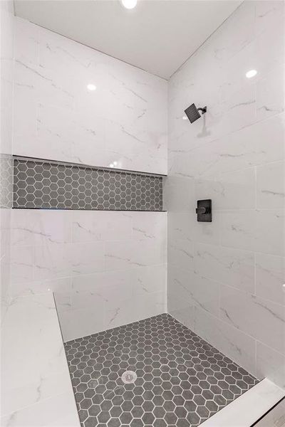 Bathroom featuring tiled shower