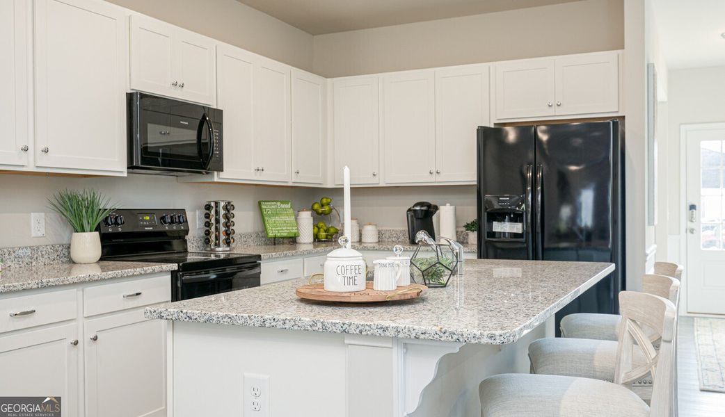 Furnished interior view inside a new home in The Cottages of Silvertown, Thomaston (Image 11).