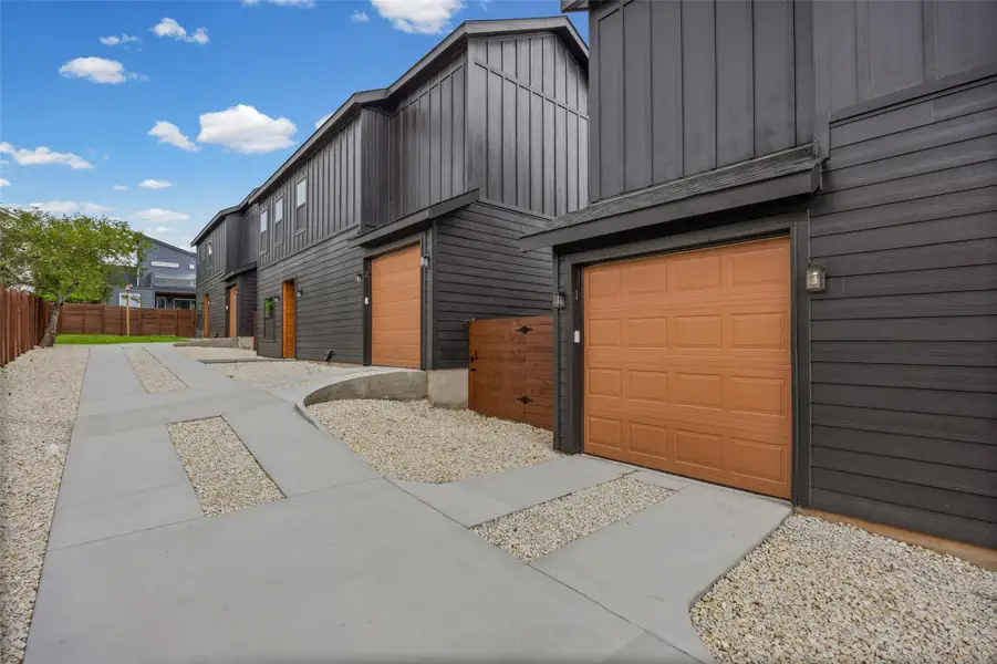 Clean architectural lines define this striking row of townhomes with convenient garages. Clean architectural lines define this striking row of townhomes with convenient garages.
