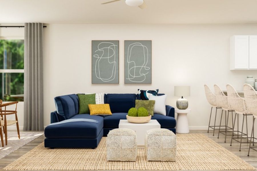 A living room with a blue couch and a blue couch.