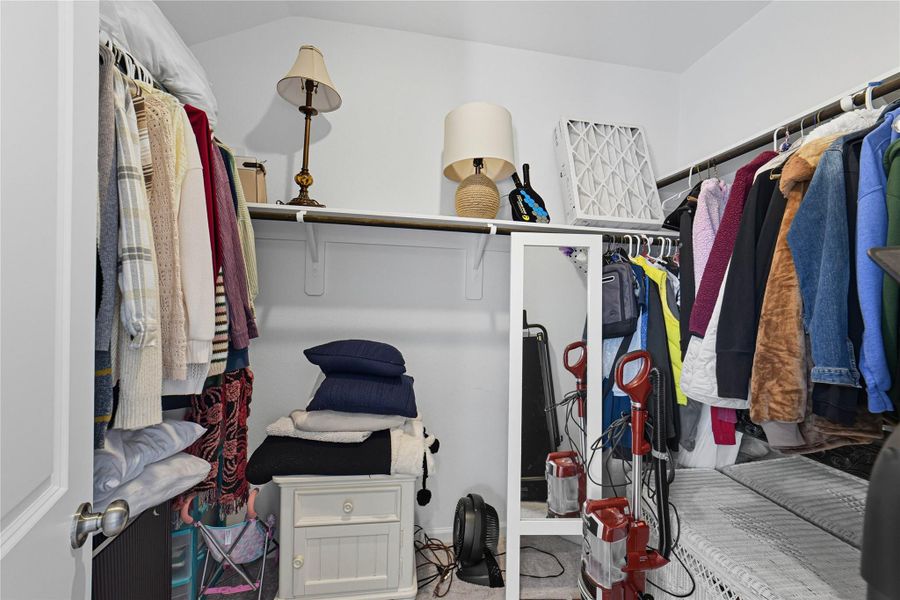 One of TWO spacious walk-in closets with ample shelving and hanging space. One of TWO spacious walk-in closets with ample shelving and hanging space.