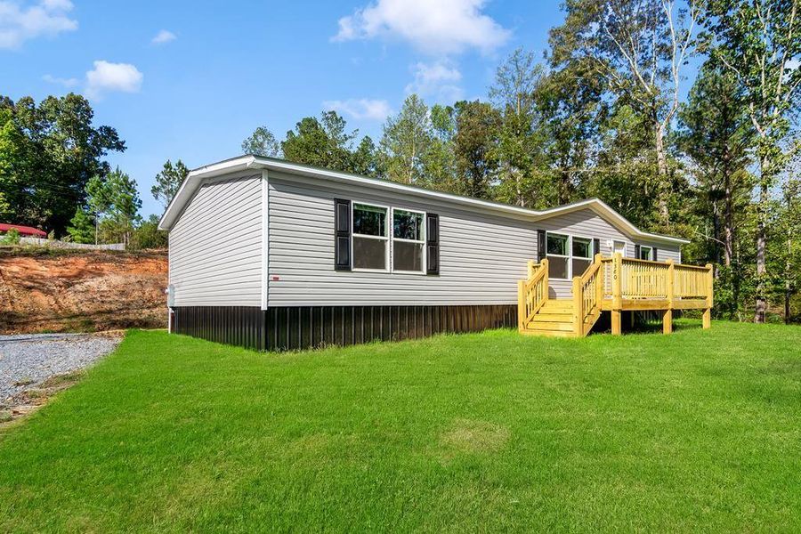Exterior details and patio area of a home in , Ellijay (Image 25).