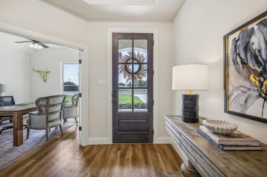 Foyer featuring dark hardwood / wood-style floors and ceiling fan