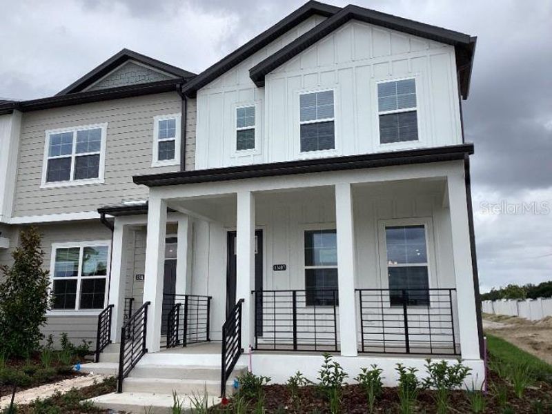 Front exterior of a new home in Lake Cawood Cove, Winter Springs, FL, highlighting curb appeal (Image 2). Front exterior of a new home in Lake Cawood Cove, Winter Springs, FL, highlighting curb appeal (Image 2).