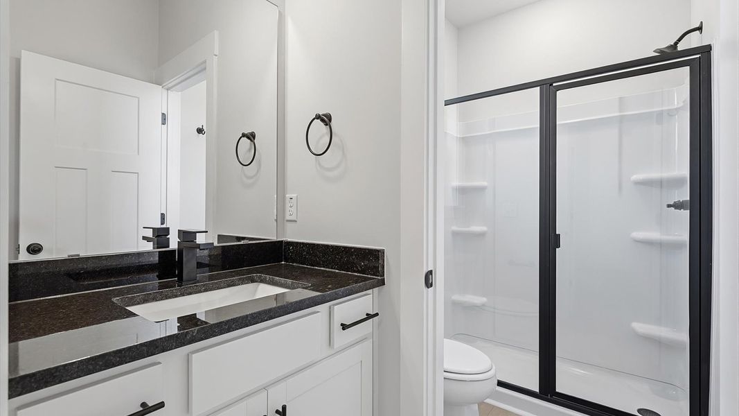 Top-notch bathroom with current fixtures, tasteful materials, and elevated charm located in Woodruff, SC