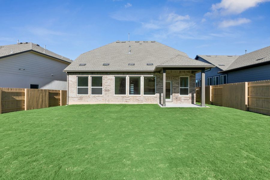 Exterior details and patio area of a home in The Colony, Bastrop (Image 3).