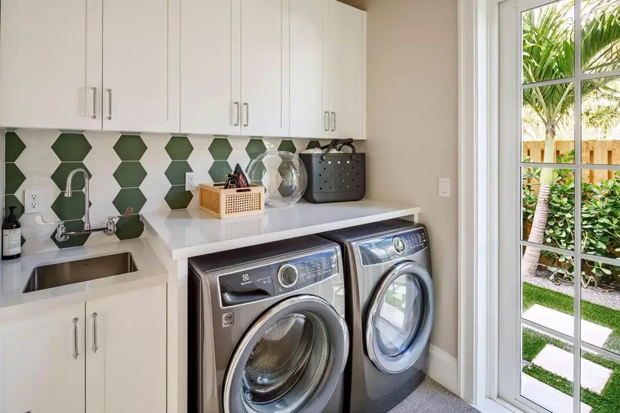 40 - Laundry room with white cabinets, g