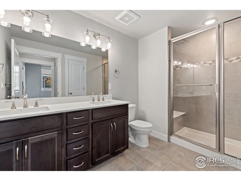 Primary bathroom w/ dual vanities