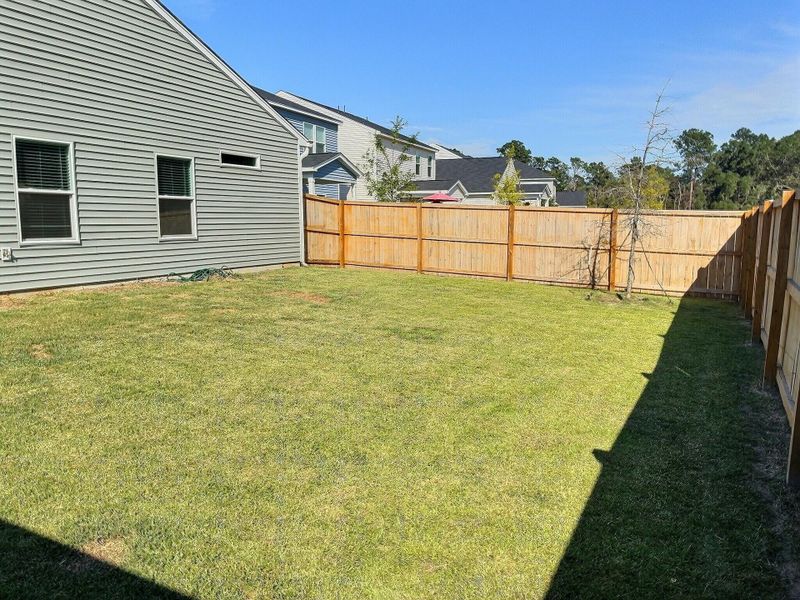 Front exterior of a new home in Six Oaks, Summerville, SC, highlighting curb appeal (Image 1).